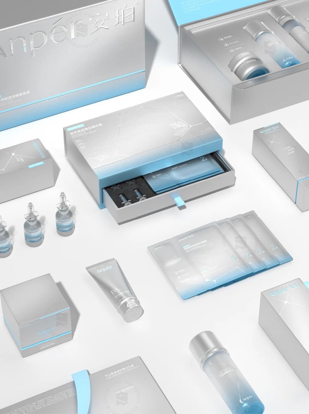 The full range laid out — drawer box, cartons, sachets, tube and bottles sharing one gradient